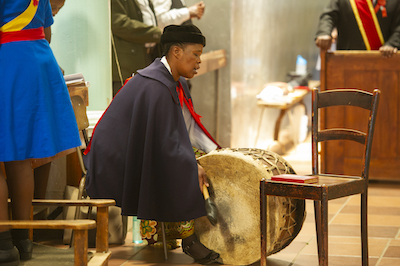 Playing the drum at Mass, Roma, Lesotho